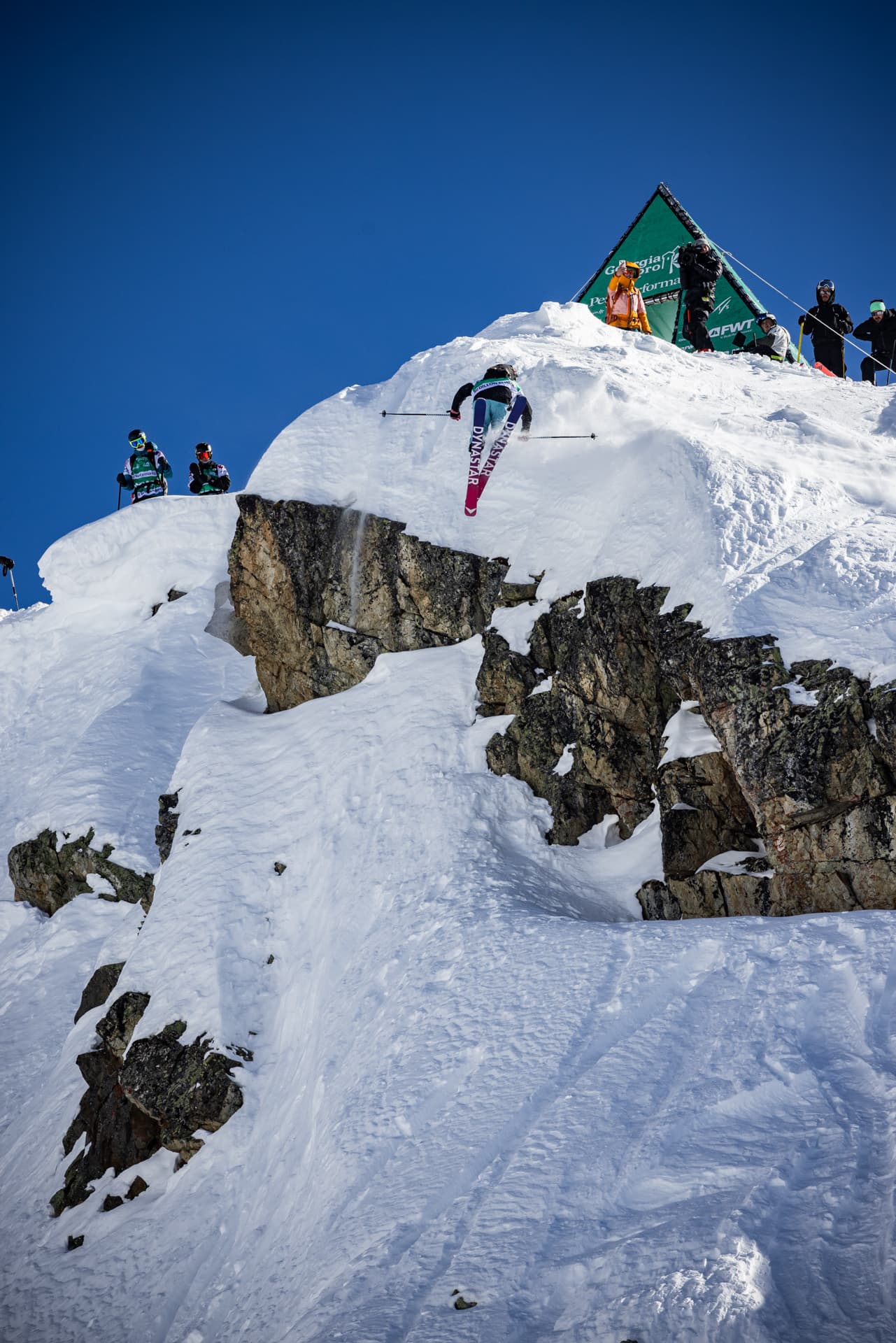 Dillon Flinders dropping into a freeride competition venue on Dynastar skis